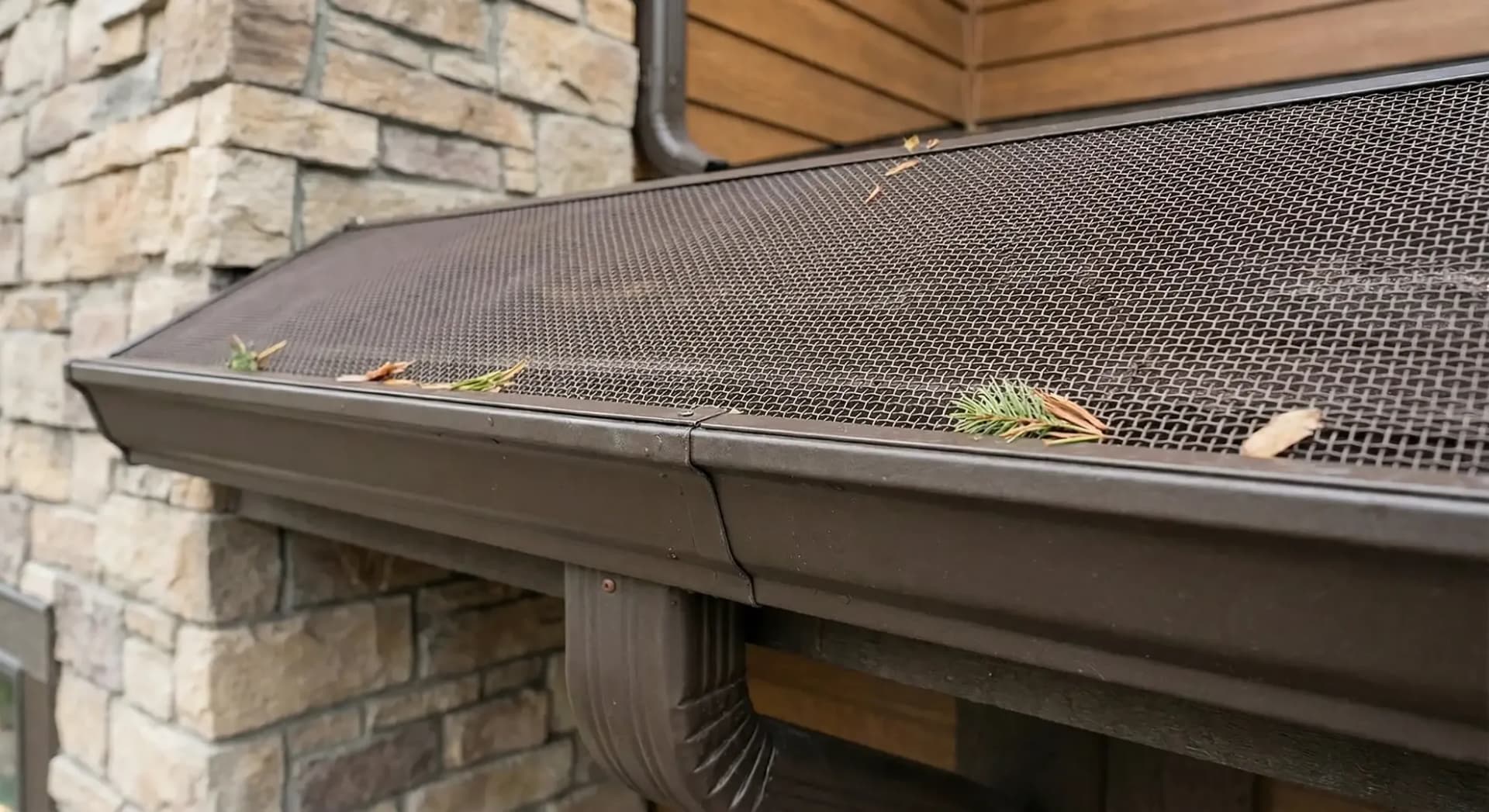 Mesh gutter guard installed over a gutter