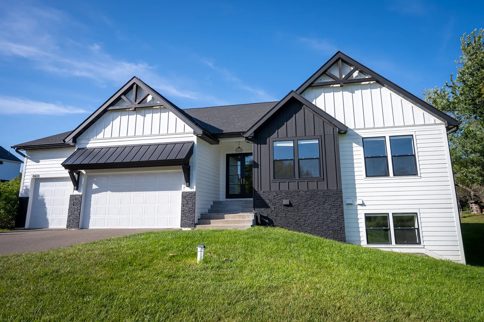 Alternate front exterior view of Otsego Construction in Otsego, Minnesota, featuring James Hardie Lap Siding and James Hardie Vertical Panels and Board-and-Batten.