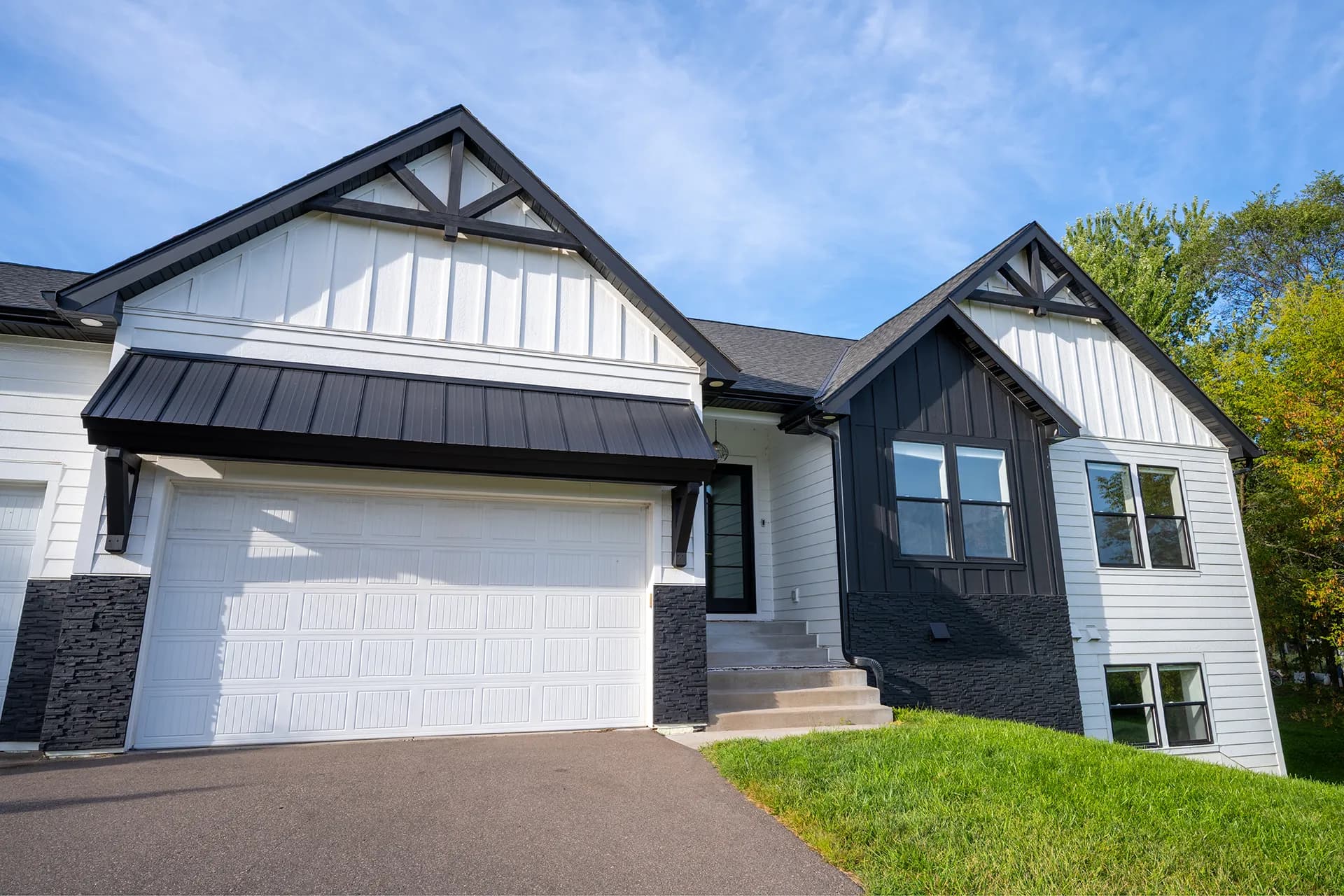 Front exterior view of Otsego Construction in Otsego, Minnesota, featuring James Hardie Lap Siding and James Hardie Vertical Panels and Board-and-Batten.